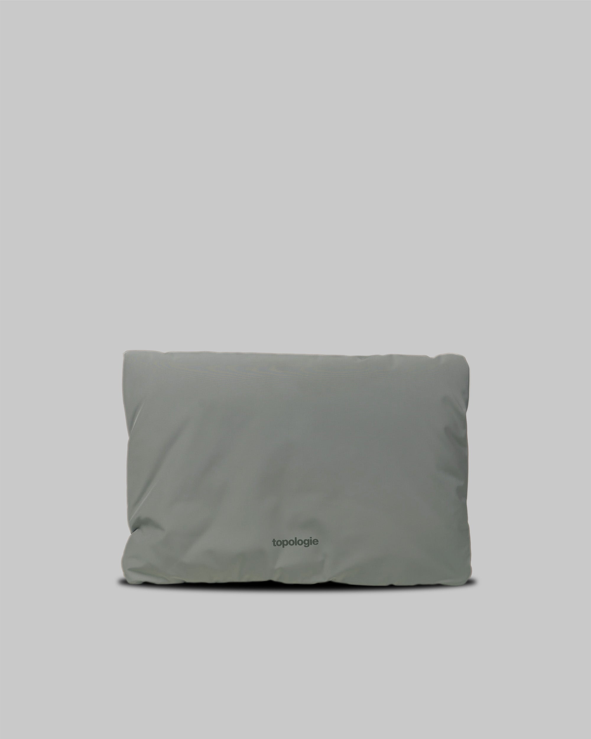 A-Frame Bag Medium in moss grey padded fabric with the word topologie printed near the bottom, shown against a light grey background.