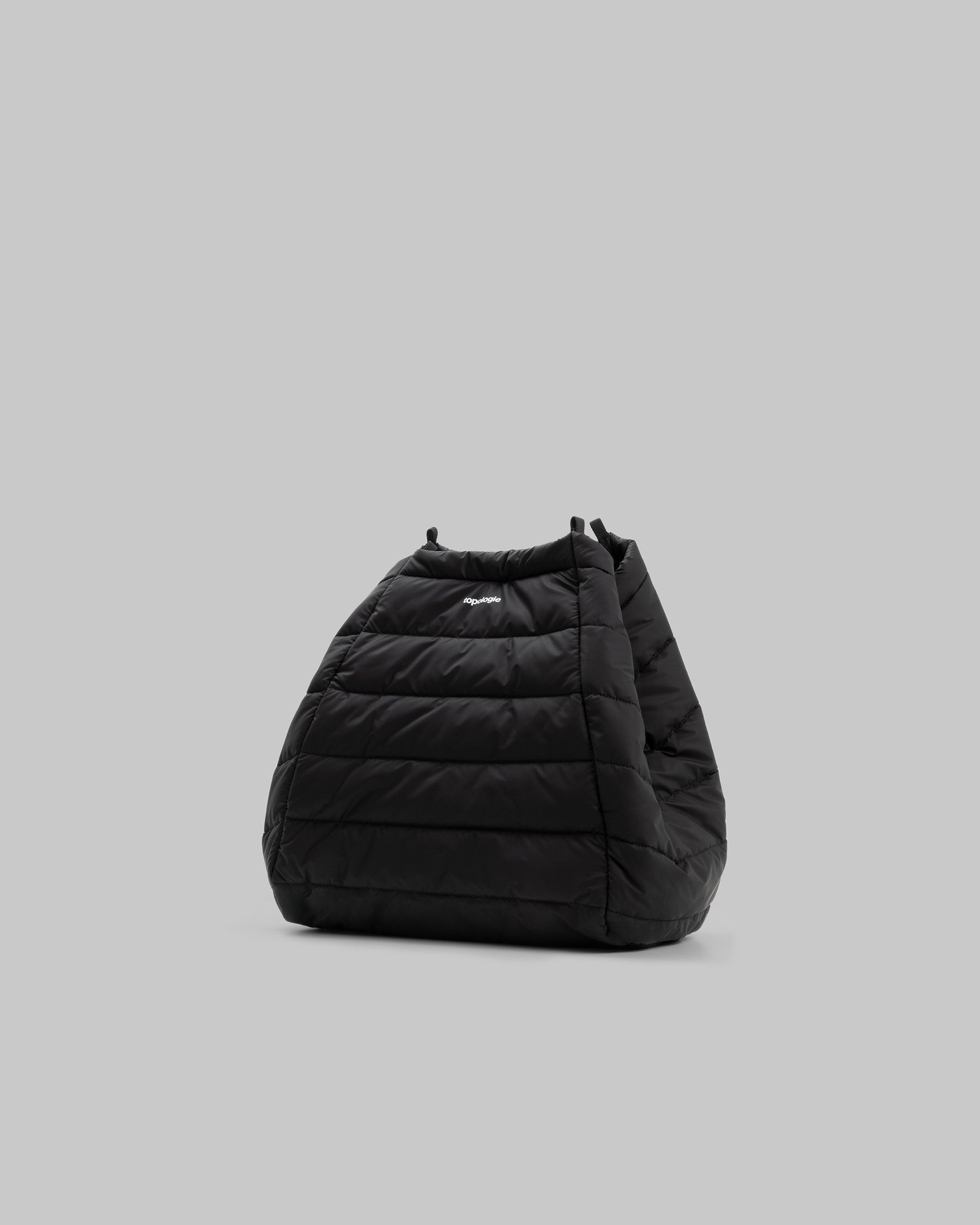 Marche Tote Large in black quilted nylon with a small white topologie logo, shown against a light grey background.
