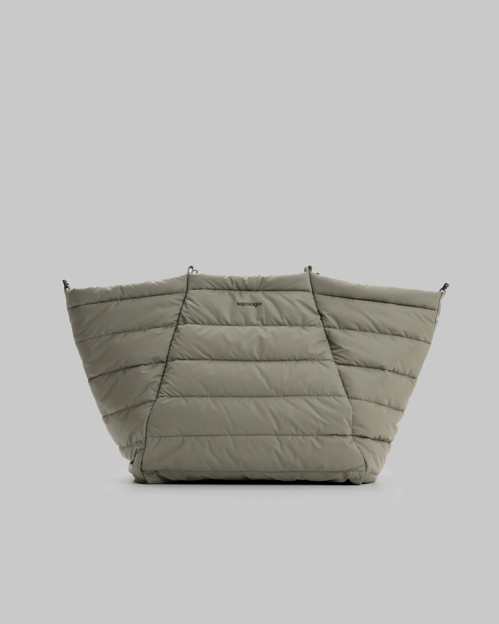 Marche Tote Large in a quilted olive green fabric with the word topologie printed on the front.