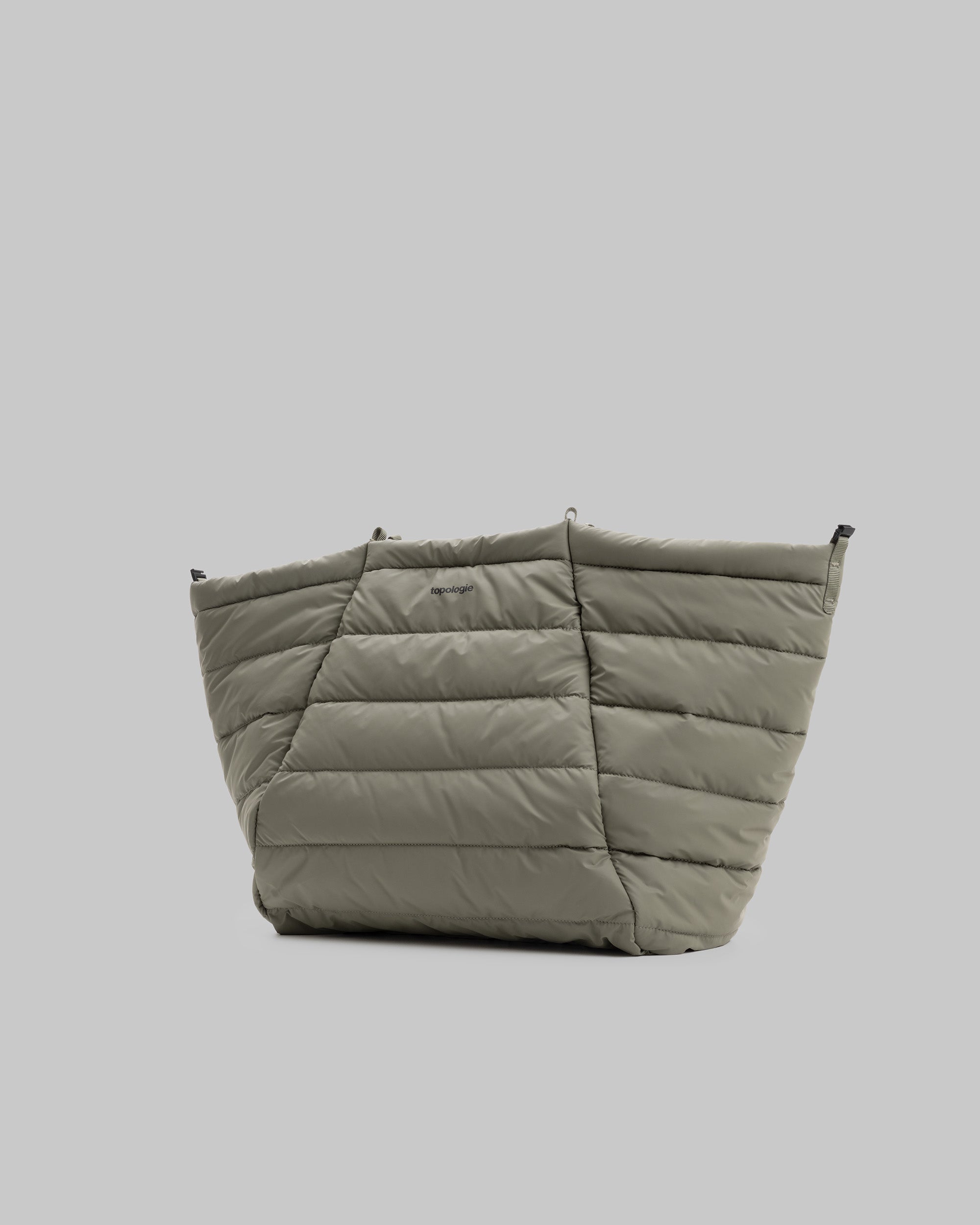 Marche Tote Large in olive green with horizontal quilted stitching and a topologie logo, shown against a light grey background.