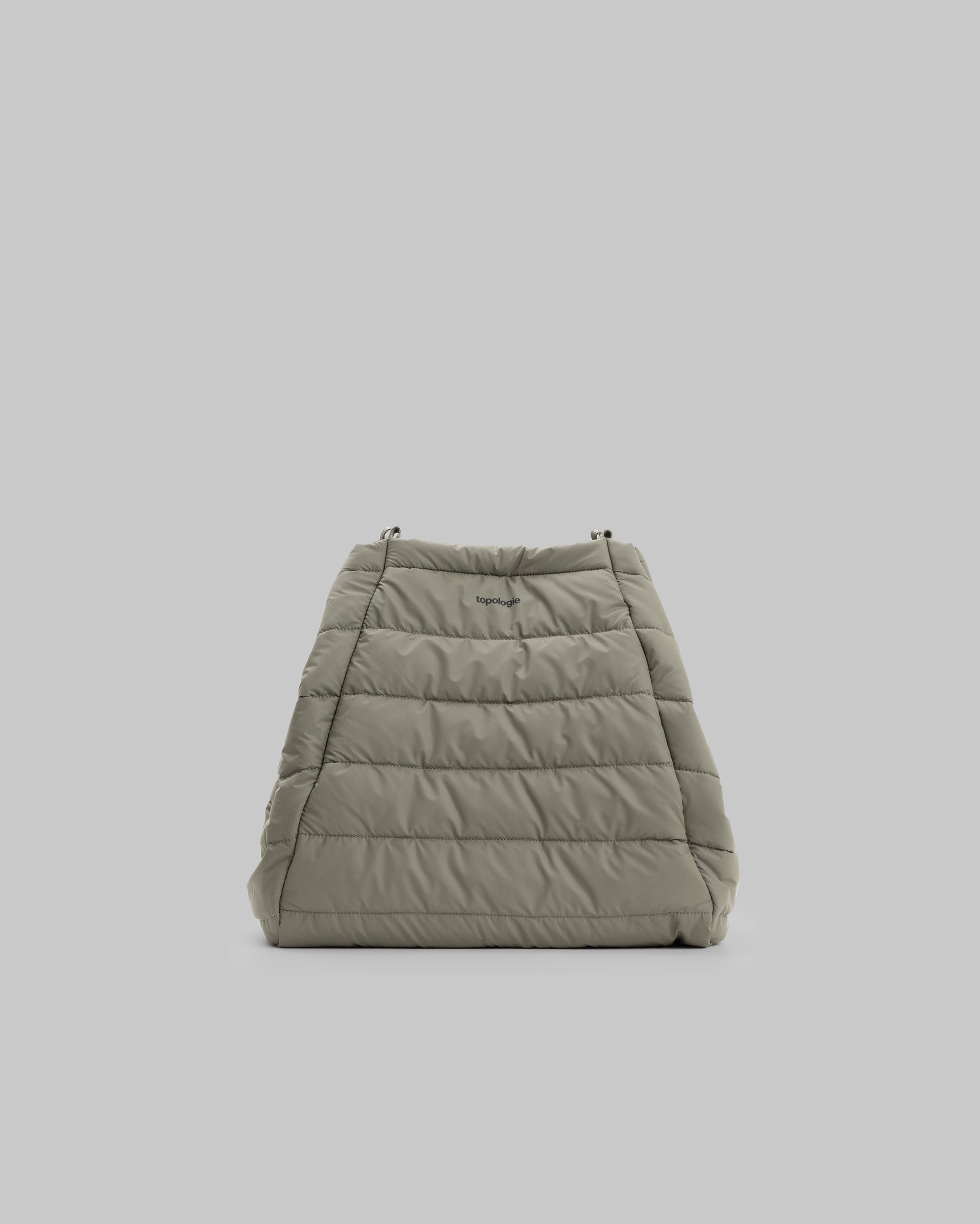 Marche Tote Large in moss green quilted fabric with a black topologie logo, shown against a light grey background.