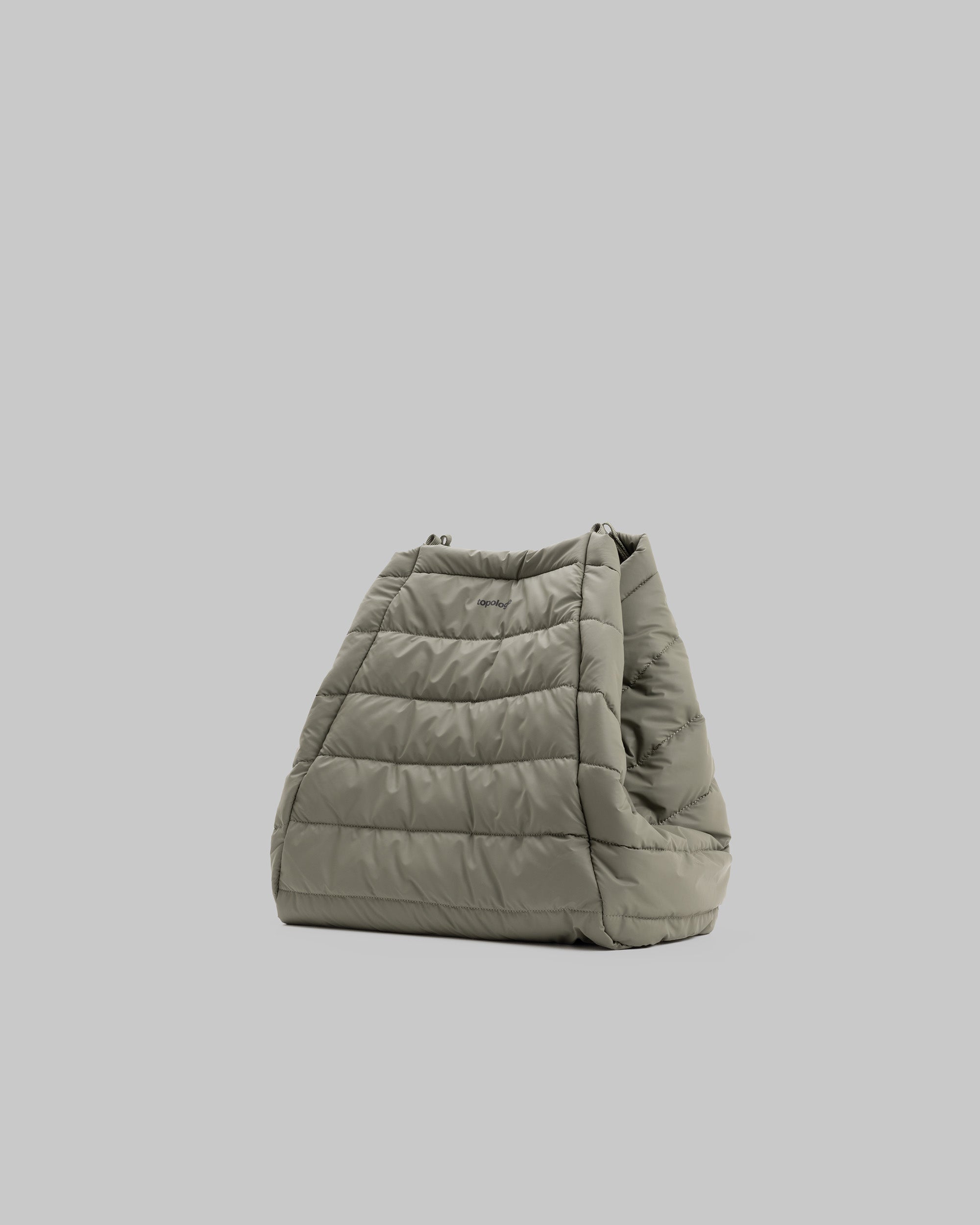 Marche Tote Large in moss green quilted fabric with horizontal stitching and a small black topologie logo, shown against a light grey background.