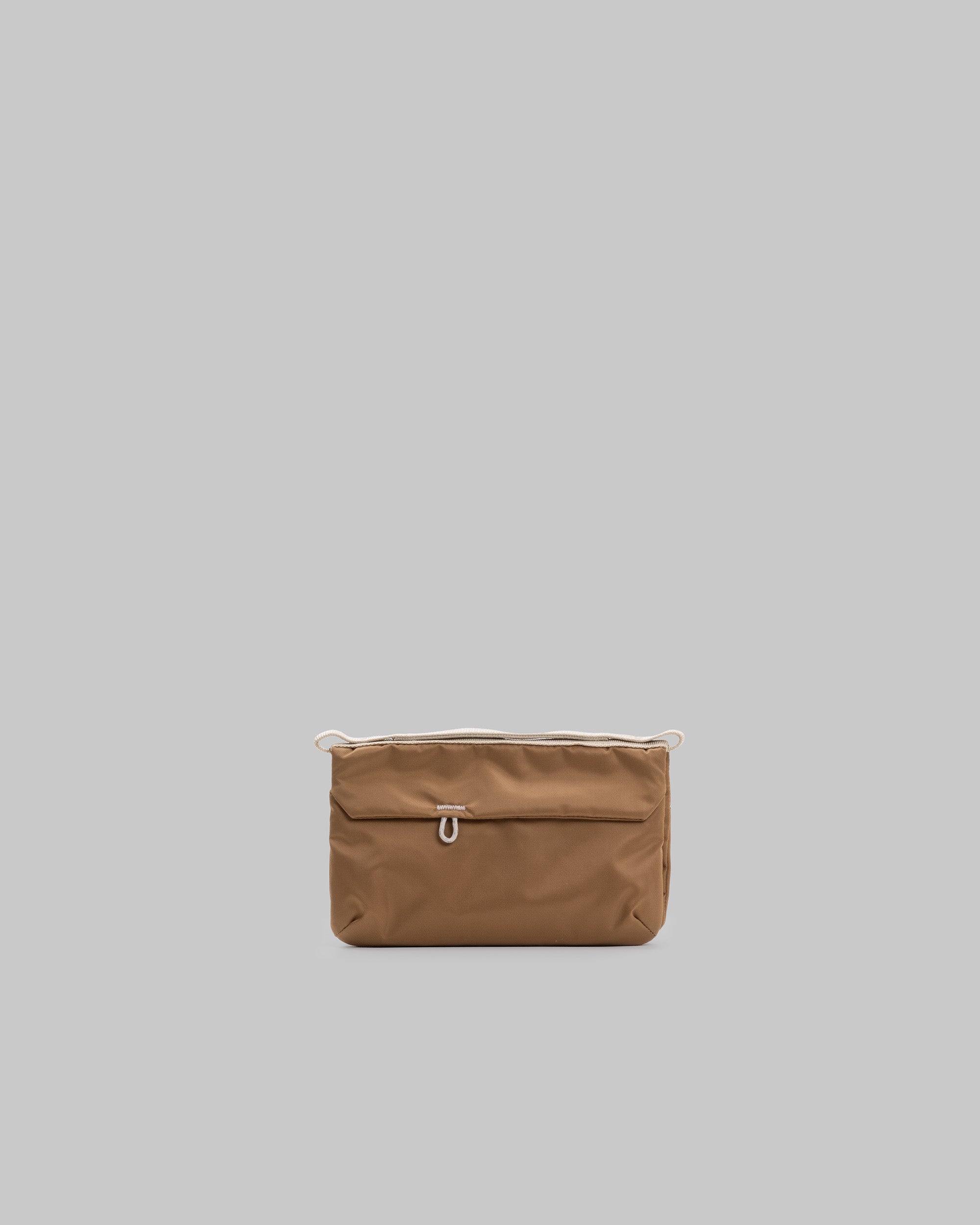 Phone Sacoche 90 in copper fabric with a white cord loop on the front flap and along the top opening, shown against a light grey background.