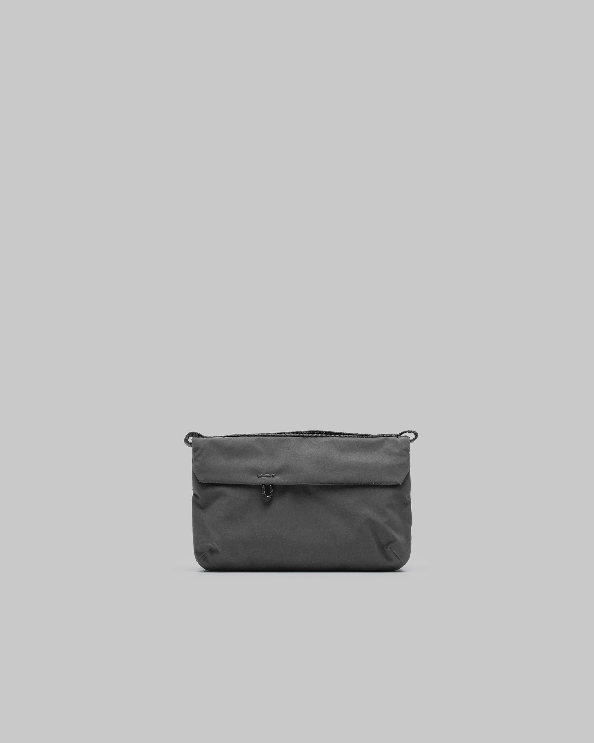 Phone Sacoche 90 in moss green needle ripstop with a front flap loop and two top corner attachment loops, shown against a light grey background.